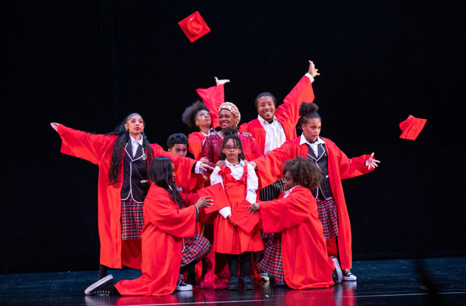 High school graduates throw their caps in the air